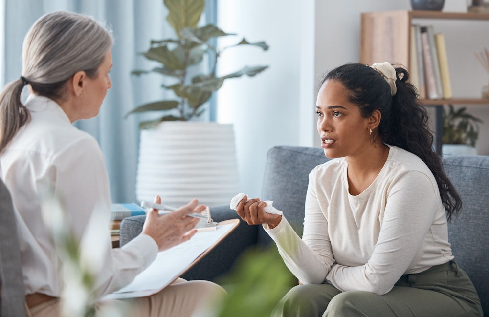 a woman with substance abuse problem talking to her therapist while they both sitting